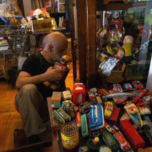 Boulotis with toys at his house