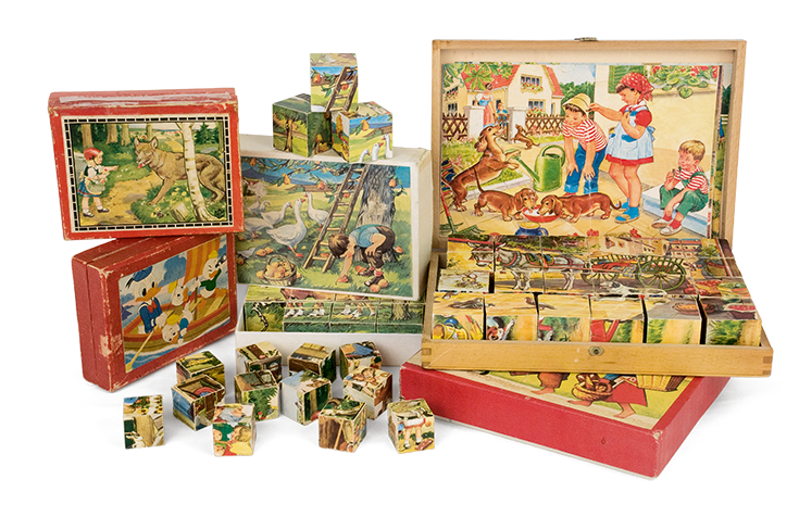 Set of boxes with puzzle pieces (cube-shaped) with different themes and pieces