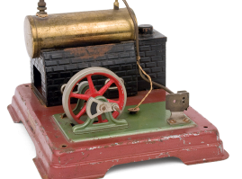 Metal steam engine adapted on a rectangular tin base, made by the German company “Fleischmann”. This dates back to the 1950s