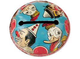 Pressed-sphere shaped tin lithographed rattle with a grip and cyan-colored on the upper half, showing figures from the world of circus around a horizontal slit