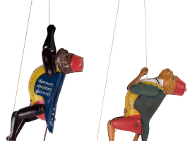 Tin circus monkeys climbing a double rope when pulled. Made by the German company Lehmann, between 1895 and 1945