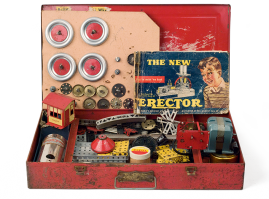 Tabletop metal building and assembly toy titled “The New Erector”, in a red metal case