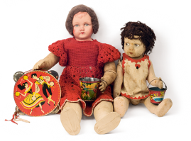 Two rag dolls in combination with tin lithographed toys. The larger doll with the head made of papier mache and the body stuffed with straw, of Greek origin, from the 1930s-40s. The smaller doll, with whinging expression, from the 1930s, is made of felt by the Italian company Lenci