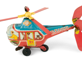 Tin wind-up marine rescue helicopter with plastic wheels and celluloid propellers, with a lithograph crew, of English origin. Dates back to approximately 1960