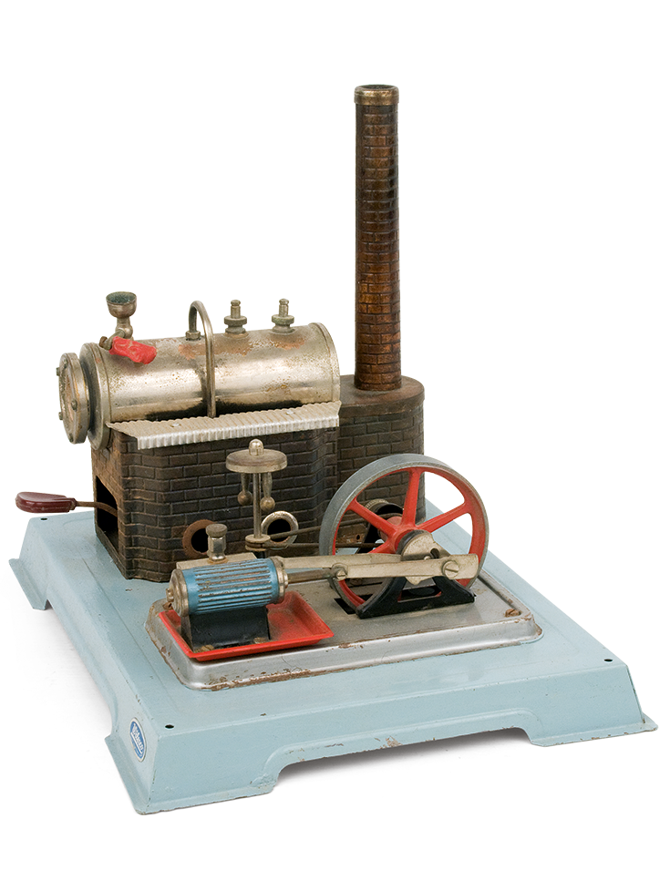 Metal steam engine adapted on a rectangular tin base, made by the German company “Wilesco”. This dates back to the 1950s-1960s