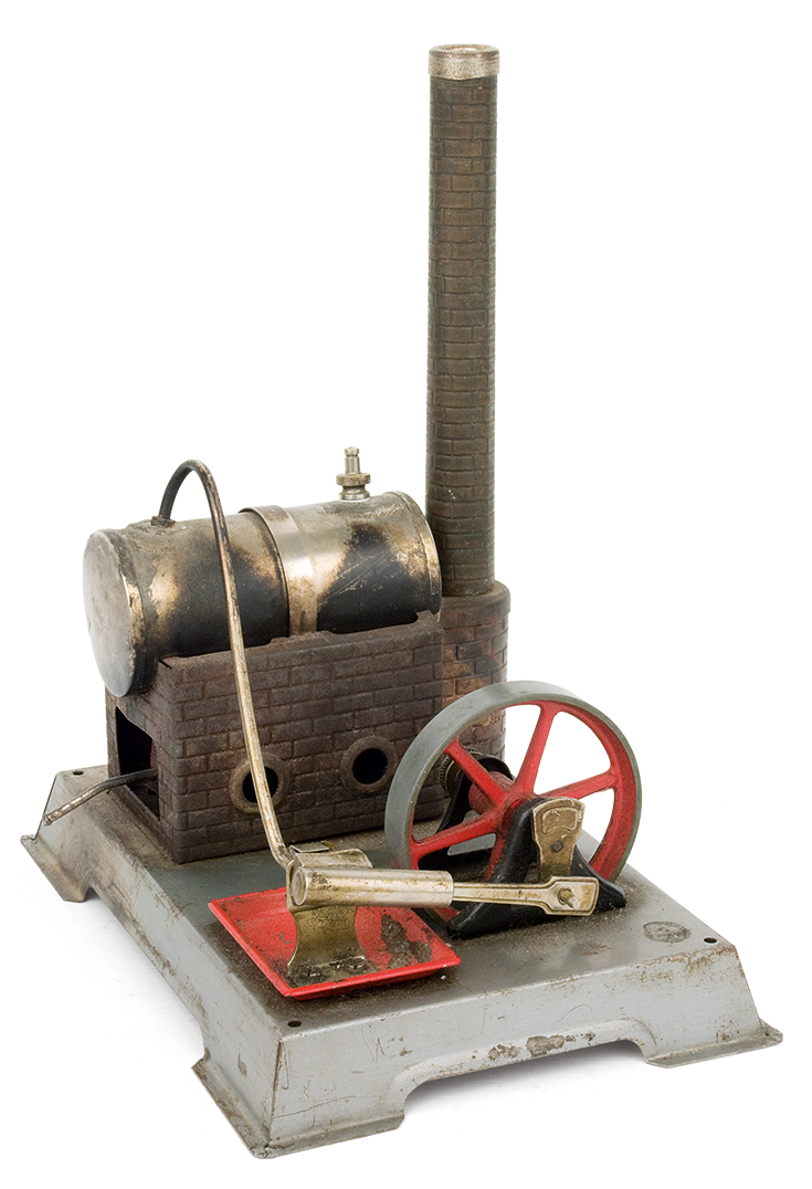 Metal steam engine adapted on a rectangular tin base, made by the German company “Wilesco”. This dates back to the 1950s-1960s