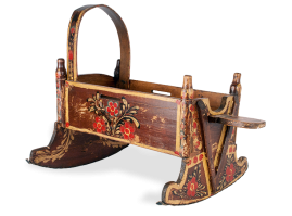 Traditional wooden sarmanitsa (cradle) from the Florina region. This cradle bears rich floral decorations
