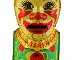 Tin lithograph piggy bank with the shape of a clown bust, made by the American company J. Stein & Co, from the 1950s