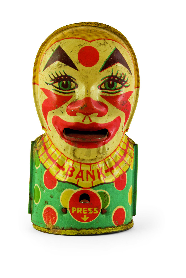 Tin lithograph piggy bank with the shape of a clown bust, made by the American company J. Stein & Co, from the 1950s