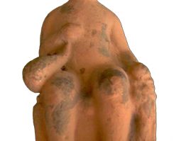 Terracotta figurine of a naked enthroned boy on tile