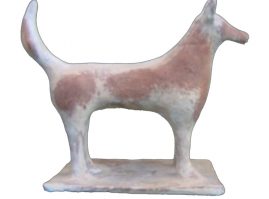 Clay dog attached to a tile